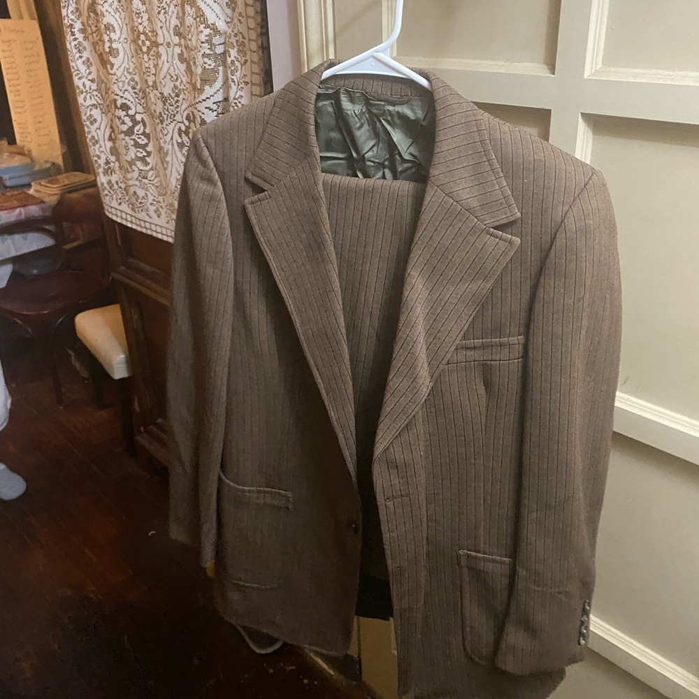 Suit jacket and matching pants. Can’t find a size anywhere. Hole on one pocket.
